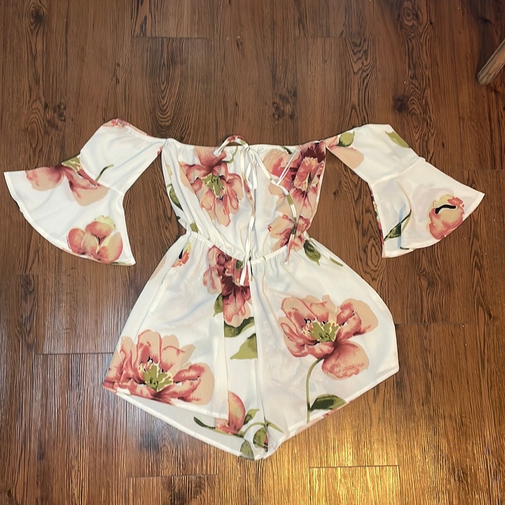 Flower romper with attached sleeves, size small